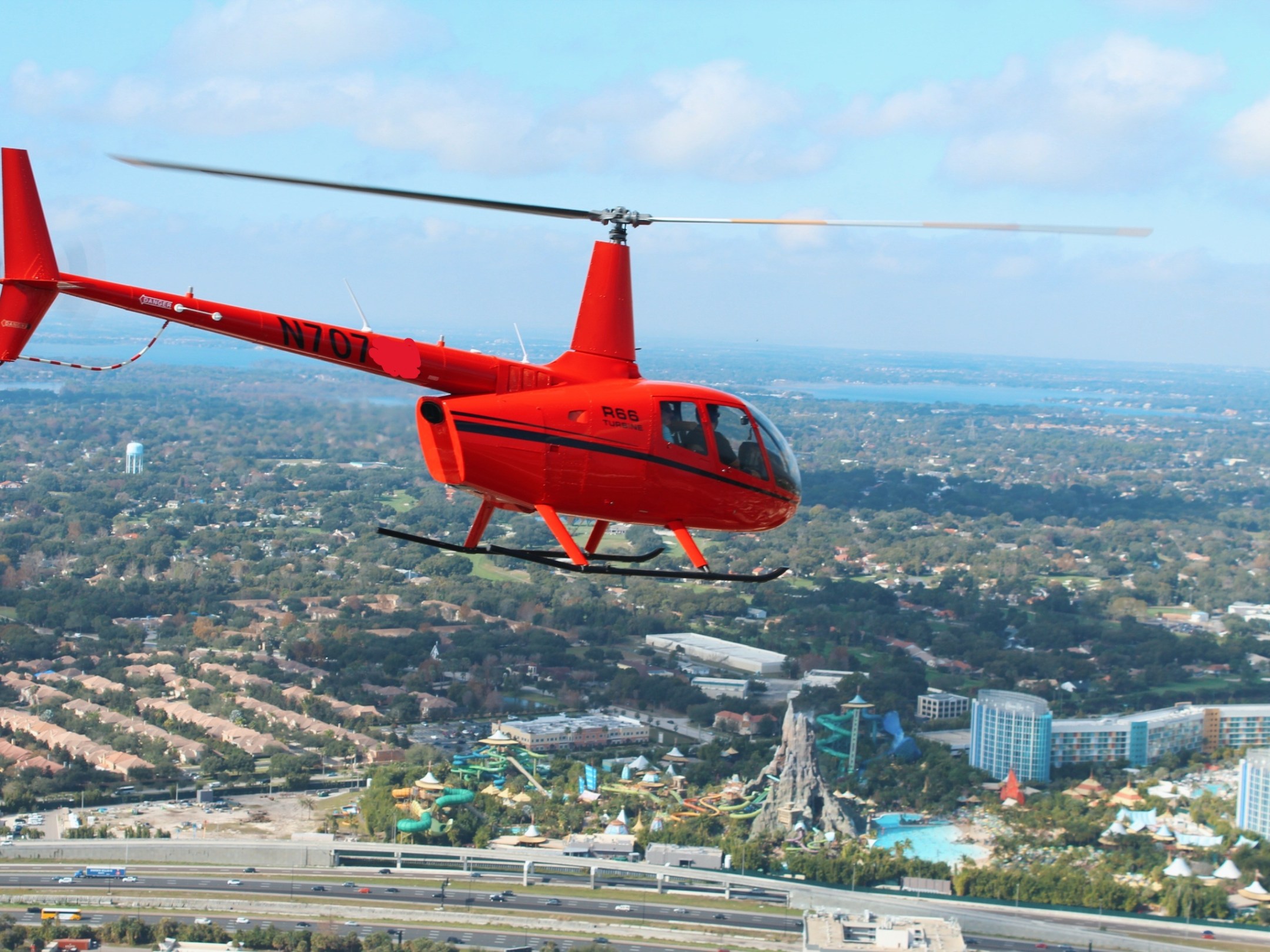 a helicopter flying over a city