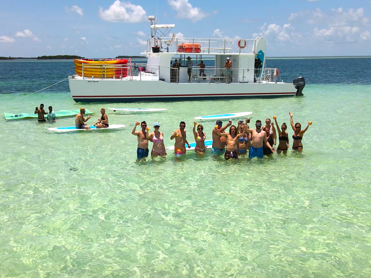 a group of people in a boat on a body of water