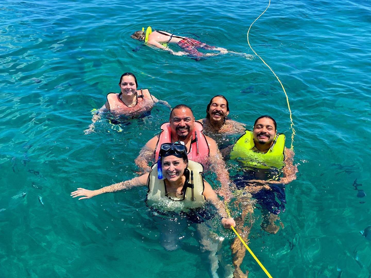a group of people swimming in a body of water